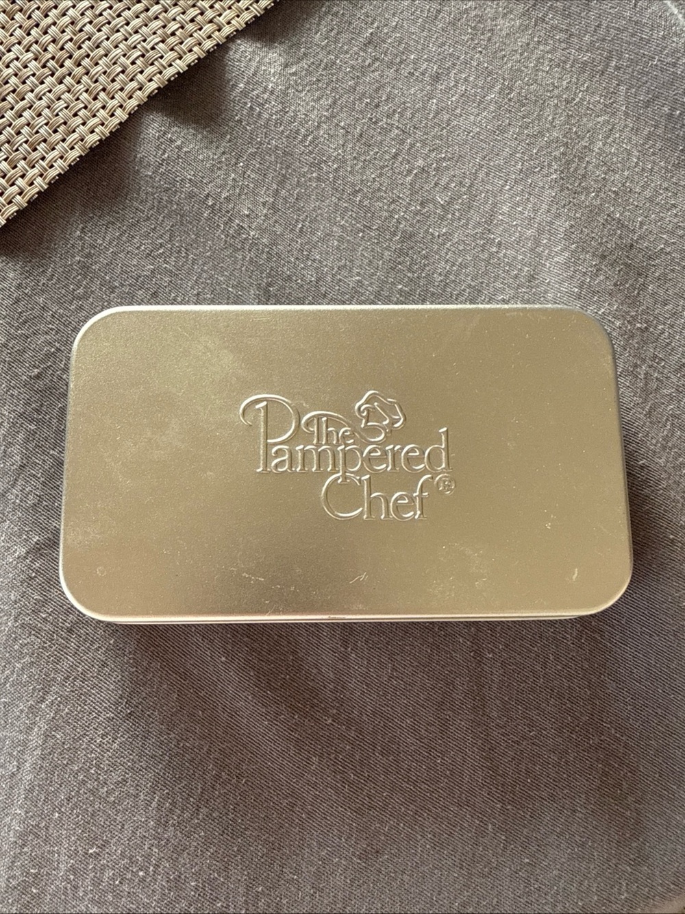 The Pampered Chef Silver Embossed Metal Tin with Cookie Cutters Set of 8